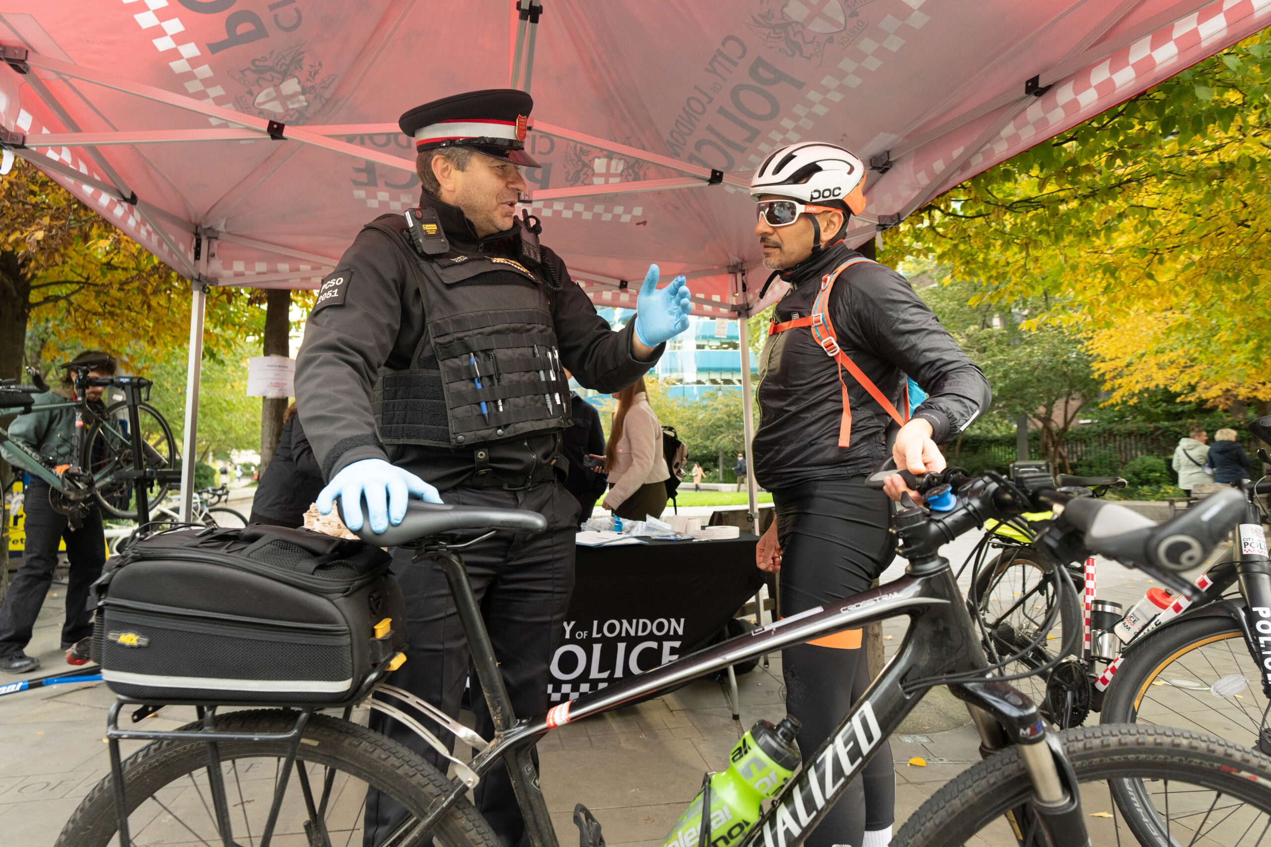 A policeman and cyclist at the Cycle Safety Pop-up at Aldgate Square